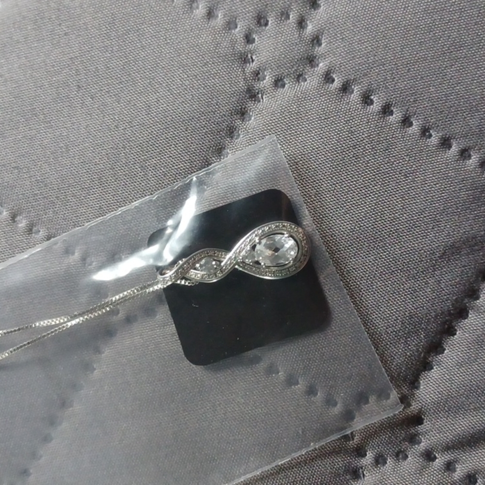 White sapphire rhodium sterling silver pendant